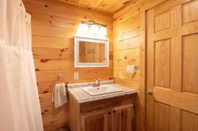 a bathroom with a sink and a mirror at Fisher Mountain Retreat in Woodward