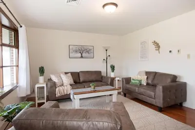 a living room with two couches and a table at Scenic View Lodging in Millerstown