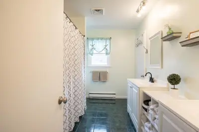 a bathroom with a sink and a shower at Scenic View Lodging in Millerstown