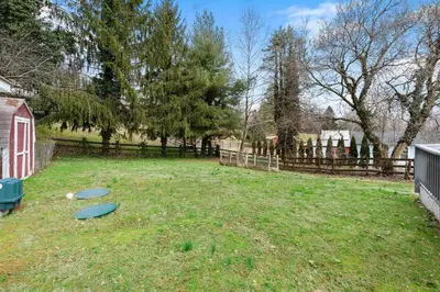 a yard with two frisbees in the grass at White Clay Creek Cottage in Newark