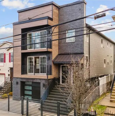 a large house with stairs in front of it at Dream! in Newark