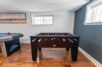 a game room with a foos ball and a table at Dream! in Newark