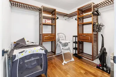 a room with bunk beds and a desk at Cityscape in Newark