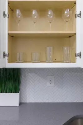 a cupboard with wine glasses sitting in it at Comfortable living in Philadelphia