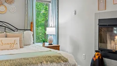 a bedroom with a bed and a window at The Boulder Inn by AvantStay Indoor Hot Tub Game Room Outdoor Fire Pit in Lake Harmony