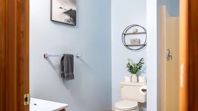 a bathroom with a white toilet and a sink at The Nest at Brier Crest by AvantStay Game Room Expansive Deck Fire Pit in Blakeslee