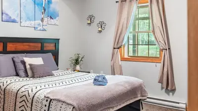 a bedroom with a bed and a window at The Nest at Brier Crest by AvantStay Game Room Expansive Deck Fire Pit in Blakeslee