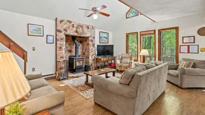a living room with two couches and a fireplace at 7mins to Skiing Fire Pit Game Table Lake Access Hygge Home by AvantStay in Blakeslee