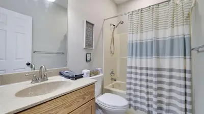 a bathroom with a sink and a toilet and a shower at The Nest at Pinecrest by AvantStay Spacious Deck Game Room Fire Pit in Pocono Pines