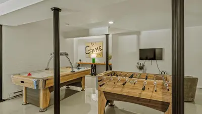 a large game room with a table and a game board at Mountain Mindset by AvantStay Pool Hot Tub Game Room Firepit in Long Pond