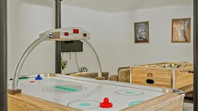 a play room with a table with a board game at Mountain Mindset by AvantStay Pool Hot Tub Game Room Firepit in Long Pond