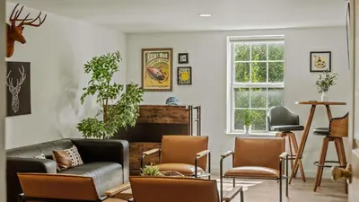 a living room with a couch and chairs and a fireplace at Mountain Mindset by AvantStay Pool Hot Tub Game Room Firepit in Long Pond