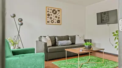 a living room with a couch and a coffee table at Mountain Mindset by AvantStay Pool Hot Tub Game Room Firepit in Long Pond