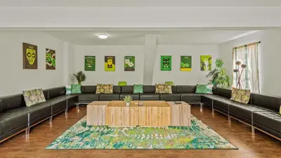 a living room with couches and a coffee table at Mountain Mindset by AvantStay Pool Hot Tub Game Room Firepit in Long Pond