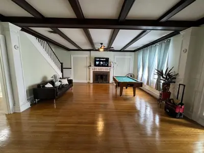 a living room with a couch and a table at Modern Queen Room Near EWR in Elizabeth