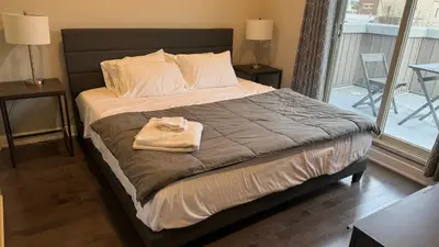 a bedroom with a bed with a towel on it at Hot Tub Four Seasons in Philadelphia
