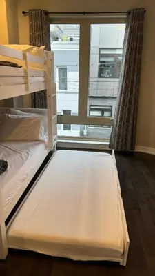 two bunk beds in a room with a window at Hot Tub Four Seasons in Philadelphia