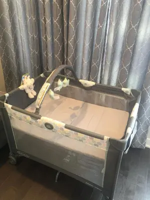 a baby crib with a teddy bear in it at Hot Tub Four Seasons in Philadelphia