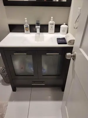 a bathroom with a sink and a white counter at Hot Tub Four Seasons in Philadelphia