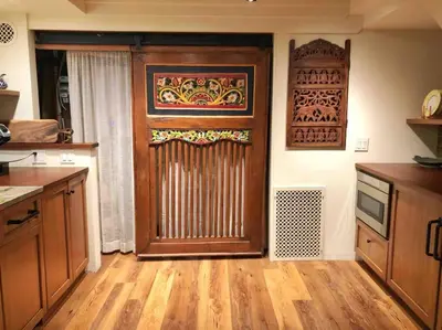 a kitchen with a large wooden door in a room at Center City Townhome in Quiet Courtyard in Philadelphia