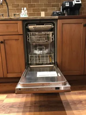 a dishwasher with its door open in a kitchen at Center City Townhome in Quiet Courtyard in Philadelphia