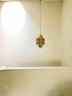 a chandelier hanging from a ceiling in a room at Center City Townhome in Quiet Courtyard in Philadelphia