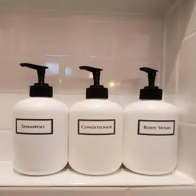 a group of three white bottles on a shelf at Fun Fishtown Rowhome - Sleeps 4 in Philadelphia