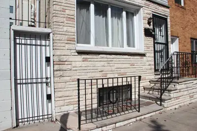 a building with a fire place in front of a window at Walk to South Philly's Best Restaurants & Bars in Philadelphia