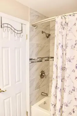 a bathroom with a shower curtain and a sink at Walk to South Philly's Best Restaurants & Bars in Philadelphia