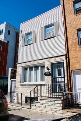 a building with a staircase in front of it at Walk to South Philly's Best Restaurants & Bars in Philadelphia