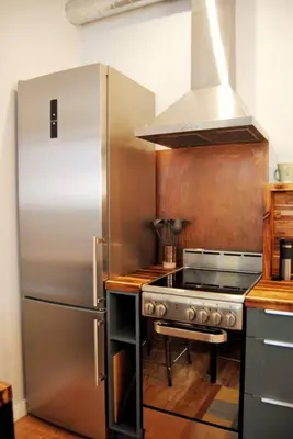 a kitchen with a stainless steel refrigerator and a stove at Trendy Studio in Prime South Philly Neighborhood in Philadelphia