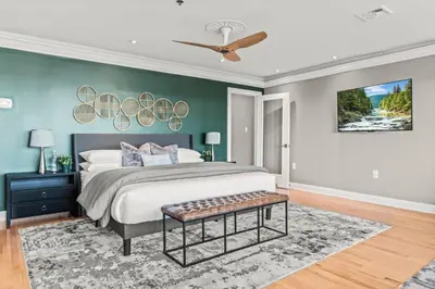 a bedroom with a bed and a ceiling fan at 5 bdrm - Heated Indoor Pool - Elevator in Philadelphia