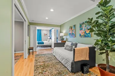 a living room with a couch and a bedroom at 5 bdrm - Heated Indoor Pool - Elevator in Philadelphia