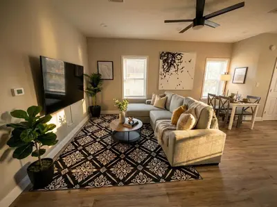 a living room with a couch and a table at The loft at Park Place - 3rd floor walk up King and Queen beds fast WIFI and free coffee in Wilmington
