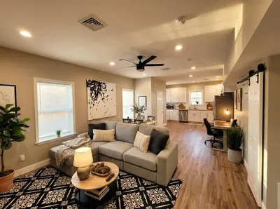 a living room with a couch and a table at The loft at Park Place - 3rd floor walk up King and Queen beds fast WIFI and free coffee in Wilmington