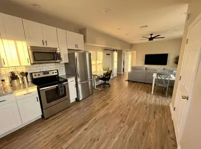an open kitchen and living room of a house at The loft at Park Place - 3rd floor walk up King and Queen beds fast WIFI and free coffee in Wilmington