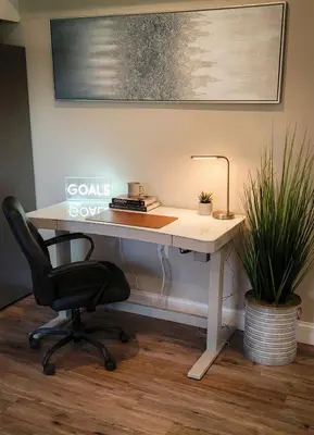 a white desk with a chair and a lamp at The loft at Park Place - 3rd floor walk up King and Queen beds fast WIFI and free coffee in Wilmington