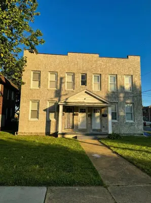 a large brick building with its door open at Modern cozy unit with King Bed in Wilmington