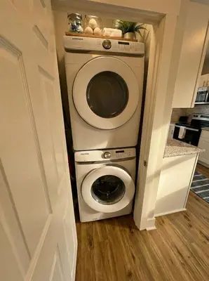 a washer and dryer in a small kitchen at Modern Cozy walk up with King Bed in Wilmington