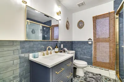 a bathroom with a sink and a toilet at Game Room and Hot Tub! Cresco Family Home in Cresco