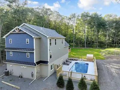 an aerial view of a house with a swimming pool at Dulce Retreat in Blakeslee