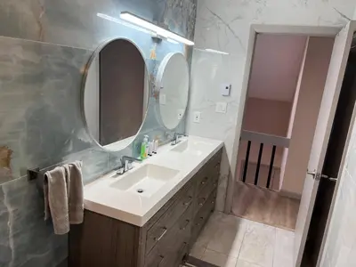 a bathroom with a sink and a mirror at Elegant saver spot in Poconos in East Stroudsburg