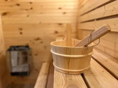 a wooden bucket with a paddle in a sauna at Elegant saver spot in Poconos in East Stroudsburg