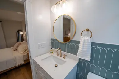 a bathroom with a sink and a mirror at Prime Location on Main Street in Stroudsburg