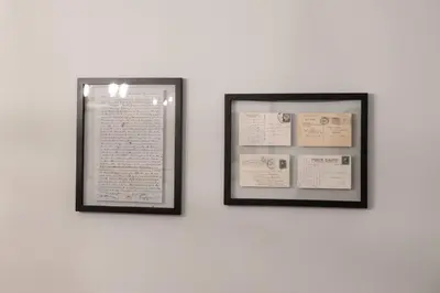 two framed pictures hanging on a white wall at Apt in the heart of Main Street in Stroudsburg