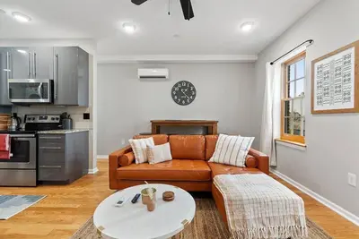 a living room with a couch and a table at Beautiful 1BD With Balcony Hosted By StayRafa - 3F in Philadelphia