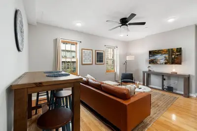 a living room with a couch and a table at Beautiful 1BD With Balcony Hosted By StayRafa - 3F in Philadelphia