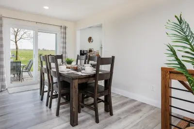 a dining room with a table and chairs at Backyard Getaway•Amish Farmland•Hot tub•Fire pit in Bird in Hand