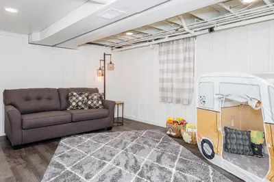 a living room with a couch and a toy car at Backyard Getaway•Amish Farmland•Hot tub•Fire pit in Bird in Hand