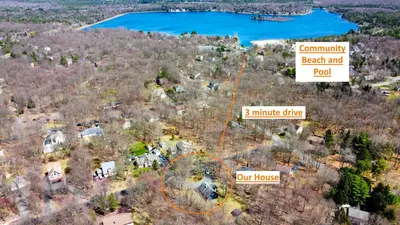 an aerial view of an estate with a house and a lake at Updated 3 BDR Gas Fire Place BBQ in Albrightsville